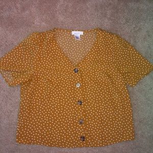yellow with white polka dots shirt
